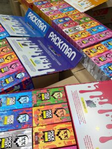 Pack man carts live diamonds wholesale display with rows of colorful Packman boxes